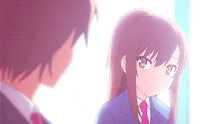a boy and a girl are looking at each other and the girl has a ponytail