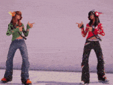 two girls are standing next to each other and one has headphones on her head