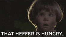 a little boy with a surprised look on his face says yep that heffer is hungry