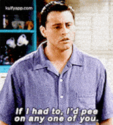 a man in a blue shirt is talking about peeing on another person .