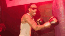 Punching Sandbag Wiz Khalifa GIF - Punching Sandbag Wiz Khalifa Weak Song GIFs