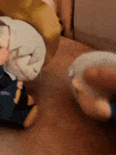 a person is holding a stuffed animal with the letter j on it