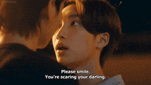 a close up of two men 's faces with one saying please smile you 're scaring your darling .