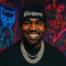 a man wearing a black beanie that says blazord