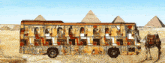 a bus with ancient egyptian symbols painted on it in front of the pyramids
