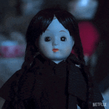 a doll with blue eyes and black hair is on a netflix ad