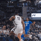 a basketball player with the number 11 on the back of his shirt