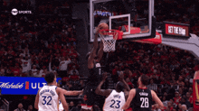 a basketball game is being played in front of a tnt sports sign
