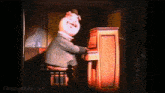 a cartoon pig is playing a piano with the website mousesteps.com visible in the corner