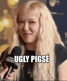 a woman with blonde hair is holding a microphone and making a face .