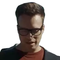 a man wearing glasses and a red shirt is making a funny face