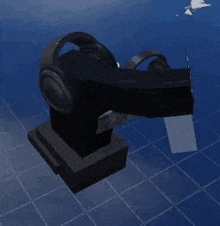 a pair of headphones are sitting on top of a statue on a blue tiled floor .