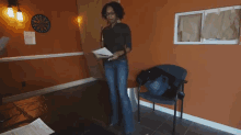 a video of two women standing in front of a door that says oottat