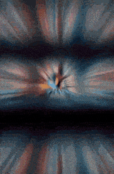 a blurry image of a person 's face with a blue and orange background