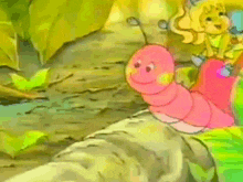 a little girl is riding on the back of a pink worm