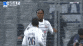 a soccer player with the number 26 on his jersey