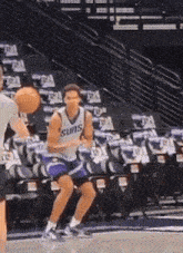 a basketball player wearing a suns jersey dribbles the ball