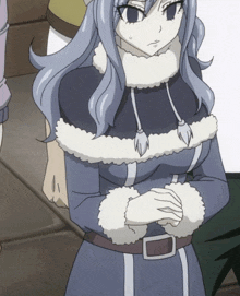 a girl in a fur coat has her hands folded in front of her chest
