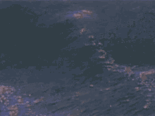 a close up of a body of water with a lot of waves coming in .