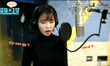 a woman wearing headphones singing into a microphone with a speech bubble that says sgbs