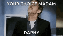 a man in a suit is looking up at the sky with the words `` your choice madam daphy '' .