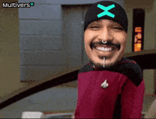 a man wearing a beanie with a x on it