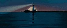 a castle rock entertainment logo with a lighthouse in the ocean