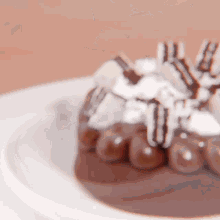 a close up of a chocolate cake with whipped cream on top