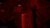 a red light is shining on a black object and the word link is on the bottom left