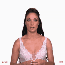 a woman in a wedding dress is clapping her hands in front of a white background that says mafs