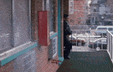 a man standing on a balcony with the words hey written on the bottom