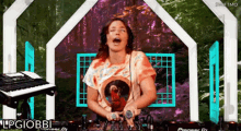 a woman is playing a pioneer dj set
