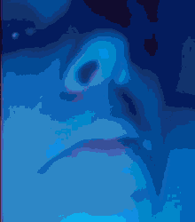 a close up of a person 's face in a dark blue background