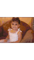 a little girl with pearls in her hair