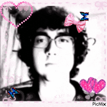 a picture of a man with glasses and a pink bow on his head is displayed on a picmix page