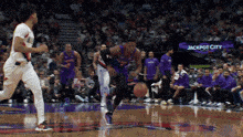 a basketball game is being played at the jackpot city