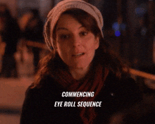 a woman wearing a hat and scarf with the words commencing eye roll sequence written below her
