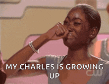 a woman covering her nose with her hand and the words my charles is growing up above her