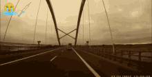 a car is driving on a bridge with a crying face and a syringe in the background