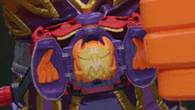 a toy with a purple and orange item that looks like a crab