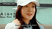 a woman wearing a hat and a sweater is talking to a man .