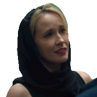 a woman with a black scarf around her head looks sad