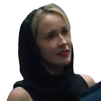 a woman with a black scarf around her head looks sad