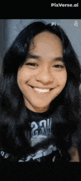 a young man with long black hair is smiling and wearing a black shirt with the number 224 on it