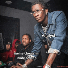 a group of men are looking at a computer screen with the caption analyst