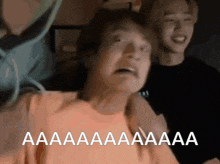 a man in an orange shirt is screaming with the words aa aa aa aa aa