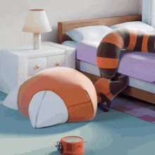 a stuffed animal is laying on a bed next to a nightstand and a lamp