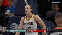 a female basketball player wearing a jersey that says fever 22