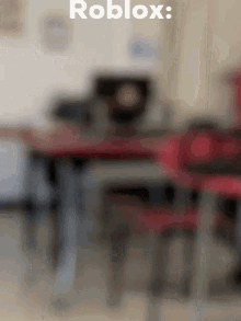a blurry picture of a classroom with the words roblox written on it