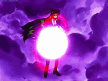 a person in a red cape is standing in front of a large pink light